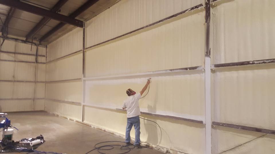Golden Eagle Insulated Storage, Man Applying Closed Cell Spray Foam and coating to a metal building
